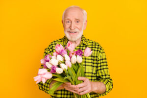 Senior Sociopath with flowers